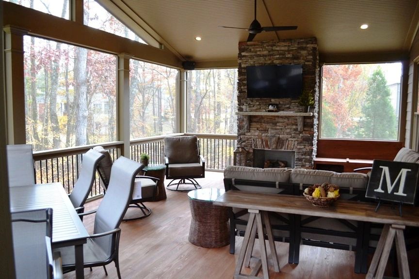 screen porch with stone fireplace